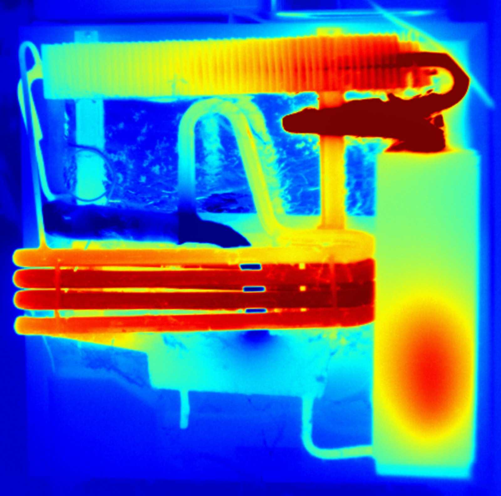 Thermal camera image of an absorption refrigerator's cooling unit, with the boiler and condenser showing hot in red and orange