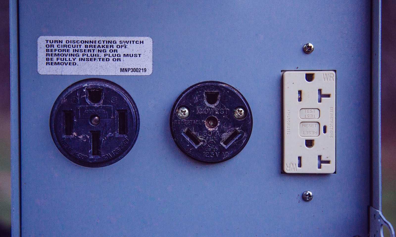 Campground electrical pedestal panel with a 50 amp receptacle, a 30 amp RV receptacle, and a 20 amp GFCI outlet