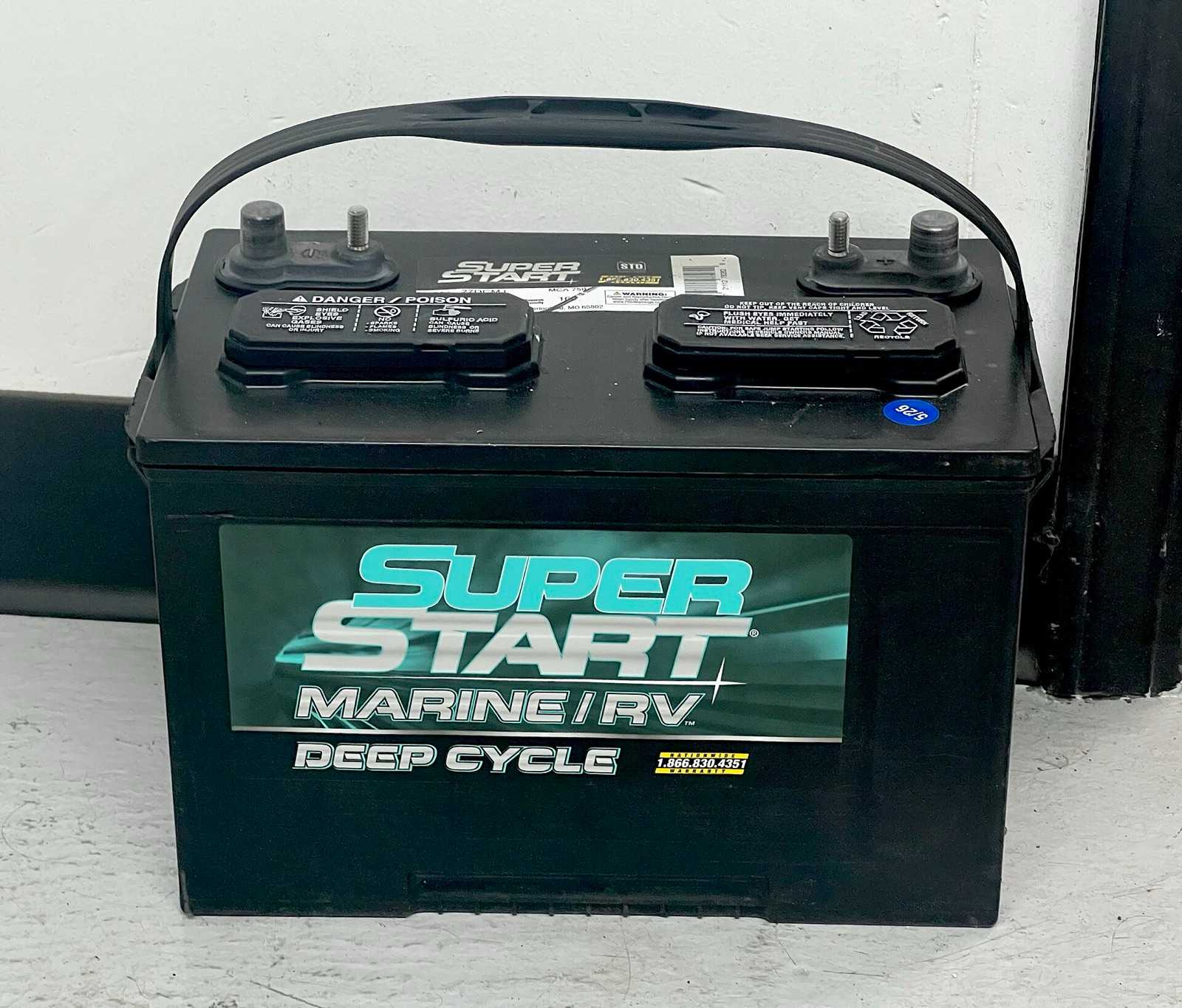Black Group 27-size flooded deep-cycle marine and RV battery with a carry handle and two top posts